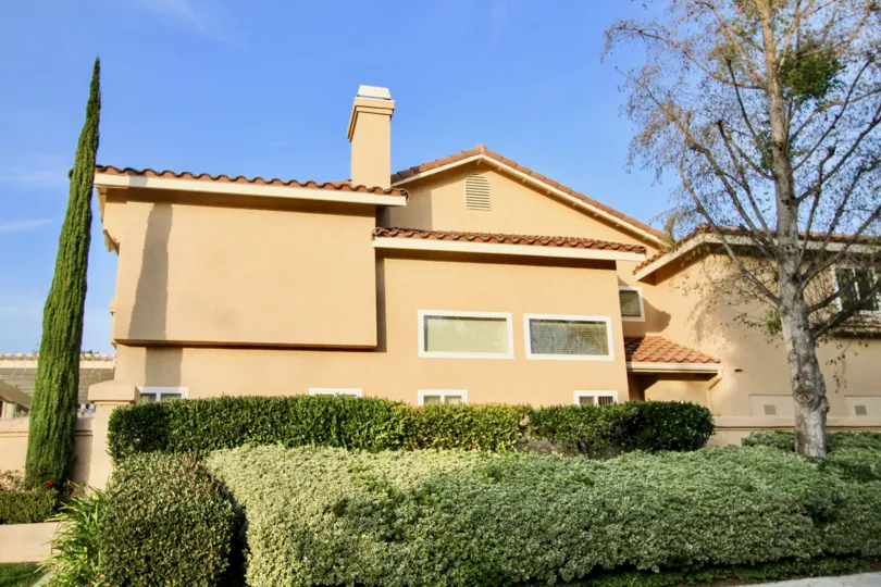 THIs image views the house front side excellent plants are planted and also the trees are there in the community of Sierra Verde