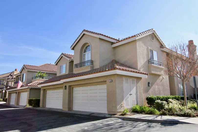 Tan homes with garages at Sonoma Court community in Rancho Santa Margarita, California.