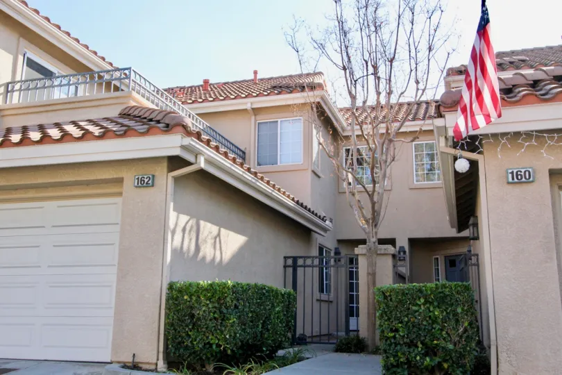 THE 162, 160 FLATS IN THE SONOMA COURT WITH THE FLAG, PLANTS, GATE