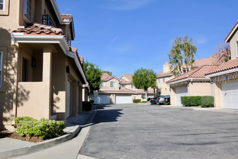 Three cars are parked at the end of a parking lot at the Sonoma Court townhomes