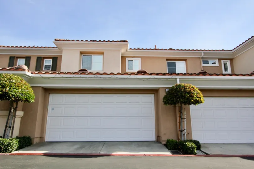 A sunny day in the area of Terracina, garages, windows, trees, roof, condo