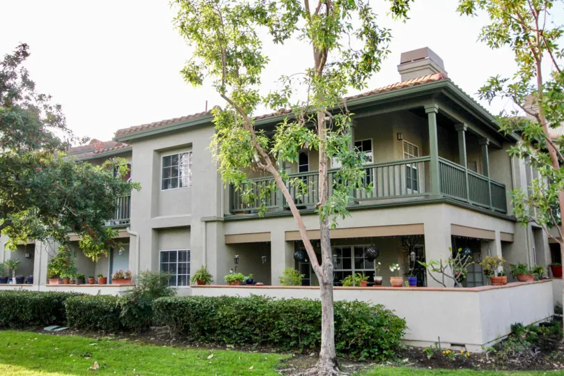 A sunny day in the area of Tijeras Creek Villas, condos, balcony, flowers, trees, windows, outside
