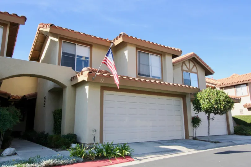 A sunny day in the area of Vista La Cuesta, flag, condo, windows, roof, lights, tree