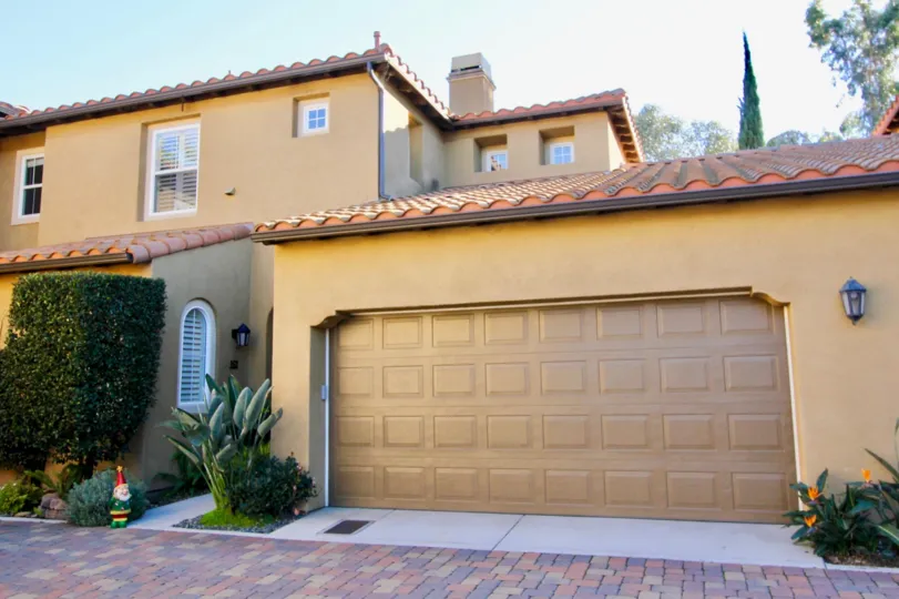 A two-storey residence painted in yellowish color in Alassio community.