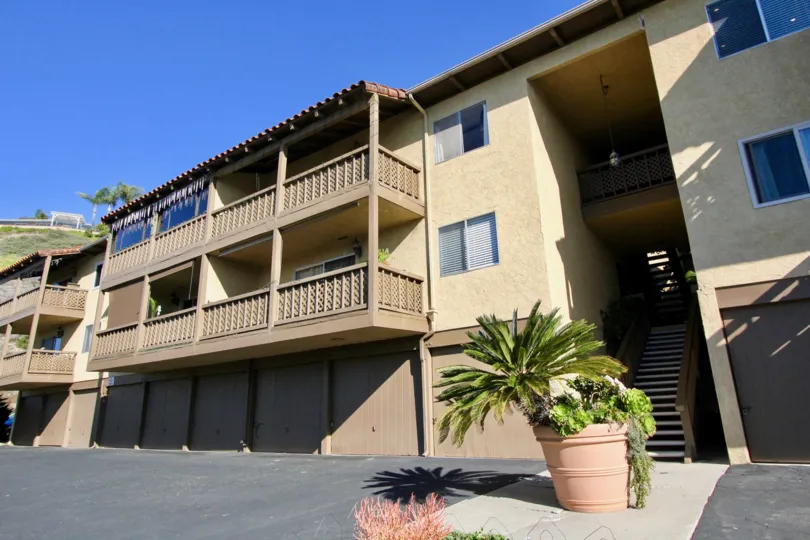 A good Apartment with parrallel houses at the morning time and it has in front of a small plant.