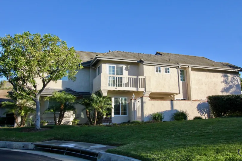 A beautiful lawn and huge tree at entrance and slanting roof in Colony at Forster.
