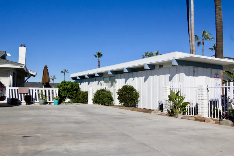 A clear sky above a small building in the Colony Cove.