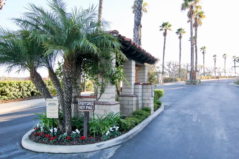Palm tree lined, gated Visitor entrance to Del Cabo Estates in San Clemente California