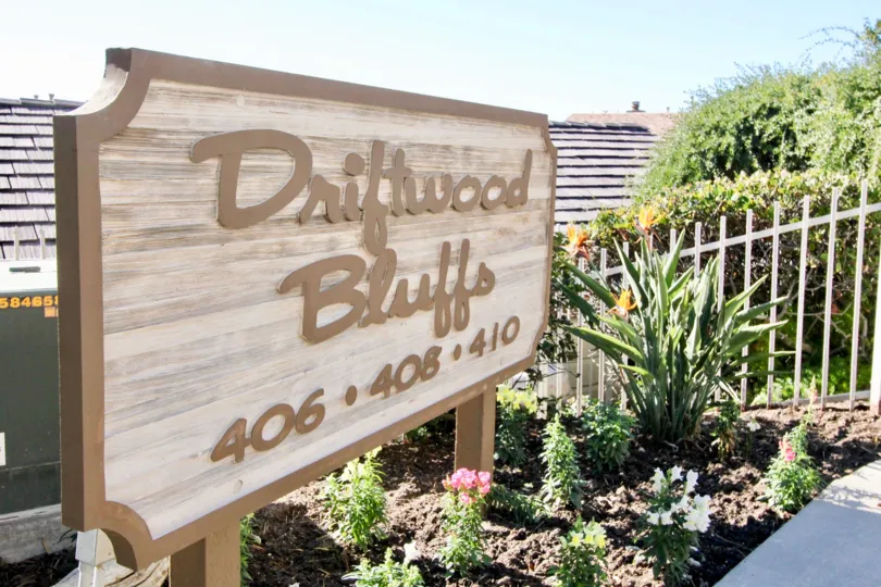 A sunny day in the Driftwood Bluffs park with beautiful Grden and street