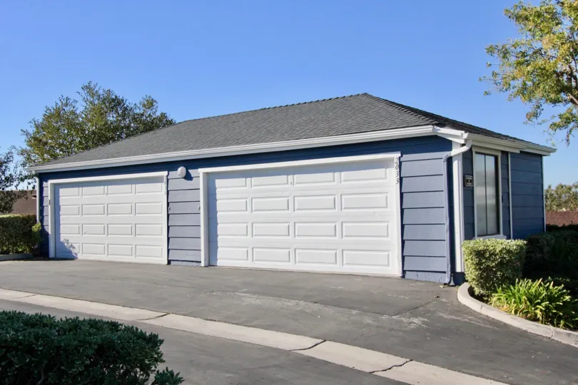 A two-car carport painted in blue in the Faire Harbour community.