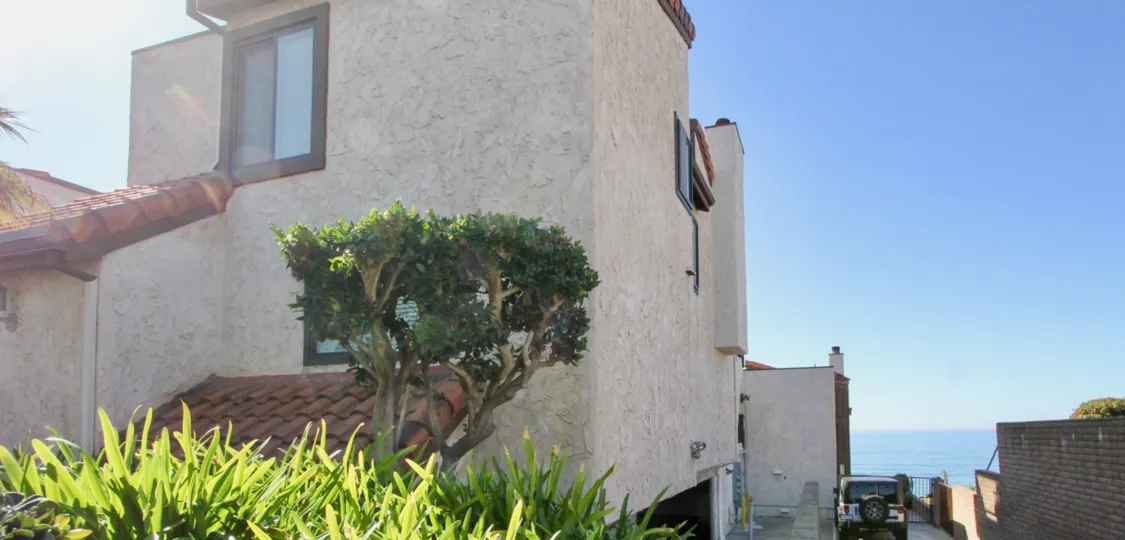 A huge duplex building side view from outside with nice wall texture and color in La Ventana Del Mar.