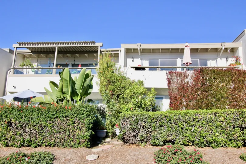 THE HOUSE IN THE OCEAN HILLS WITH THE BANANA TREES, FLOWER PLANTS