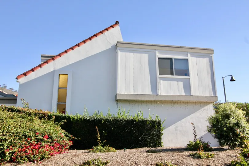 Beautiful view of a building from outside with nice plantation in Ocean Hills.