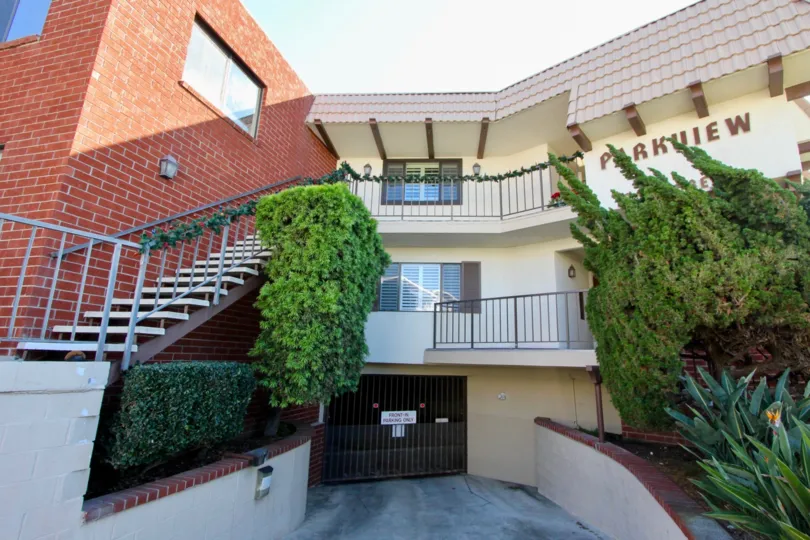 A splendid house with a gate to enter for parking and it is a two storey building with the word mentioned, "PARKVIEW"