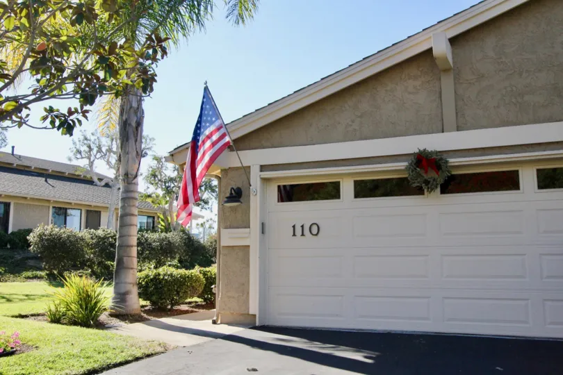 A closed garage with a flag in the President Heights I neighborhood.