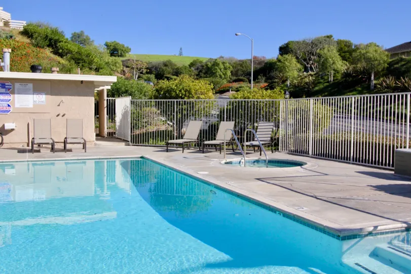 A sunny blue sky day at the community pool in President Heigths II