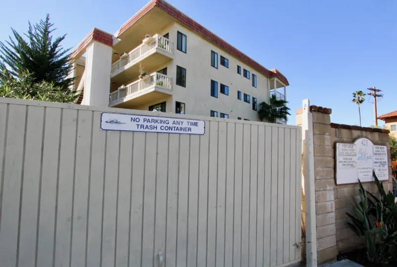 A view over a fence of apartment building in Reef Gate West.