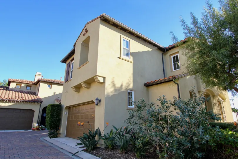 THE SANTALANA Largest floor plan in Verano with 3 bedrooms, 2. 5 baths, and a downstairs office/den, and an open floor plan. The living room has a gas fireplace, a built-in entertainment center, wood flooring, a ceiling fan, and plantation shutters. The k