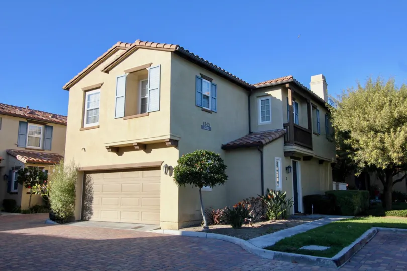 Sunny day in Santalana with this beautiful detached sandstone home with red-clay shingles