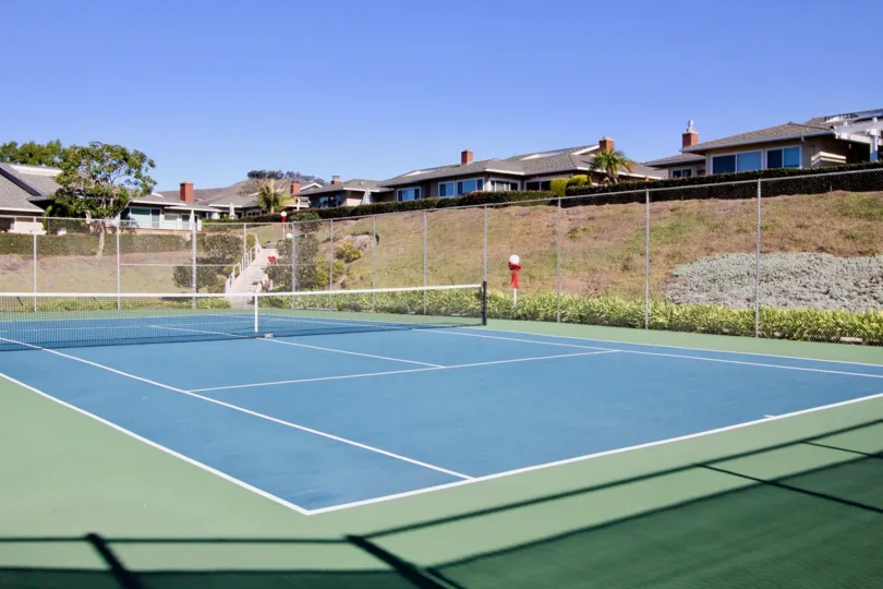Seascape Village is under a homeowners association with monthly dues required which include a nice community pool, spa, tennis court, clubhouse and water.