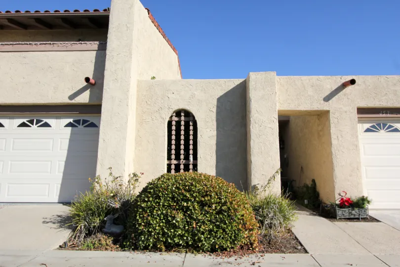 Distinctive entry and front view in true spanish adobe stying at the Summer Place community