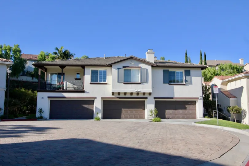 The best location in the Trinidad development with only one attached unit. This home has just been completely updated! Brand new carpet throughout the living areas, neutral paint, bright white cabinets and new flooring in the kitchen and baths. This light