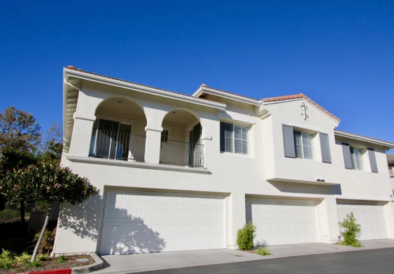 A two-storey townhomes with three carports in the Trinidad community.