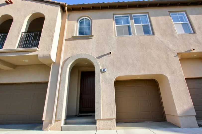 Unique architectural style shows single car garages with private entryways at the Verano community