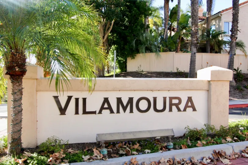 THE WALL IN THE VILAMOURA WITH THE BUILDING, TREES, PLANTS