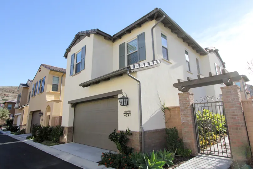 A house with a gate in Campanilla in San Juan Capistrano, CA