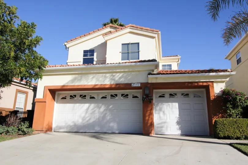 Outstanding Campanilla home in San Juan Capistrano shines against the blue sky on a sunny day
