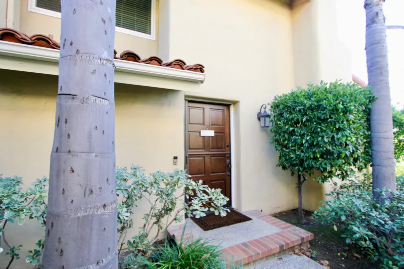 Trees and door in Cancun Racquet Club in San Juan Capistrano, CA
