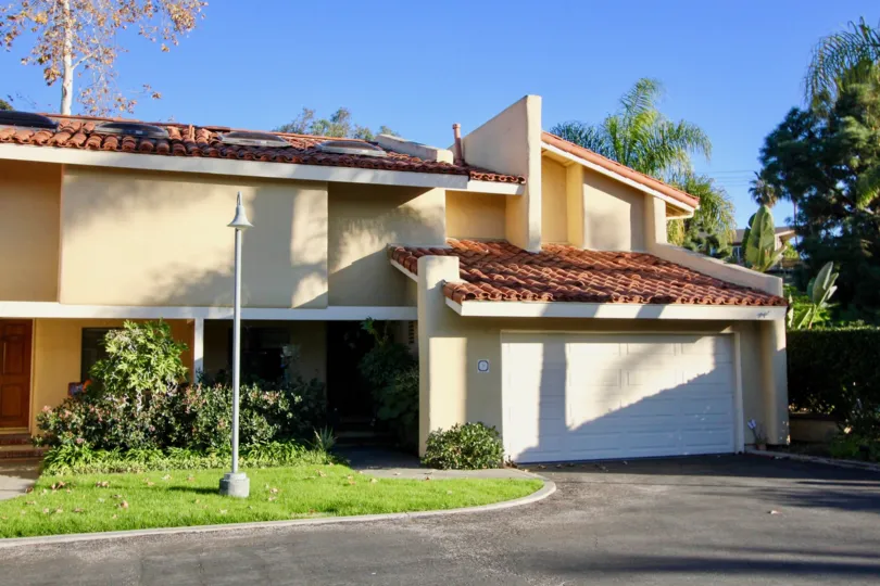 Driveway and garage at Cancun Racquet Club in San Juan Capistrano, CA