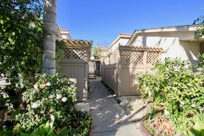 Entryway to a residence in San Juan Capistrano, California at Capistrano Villas. Entryway surrounded with beautiful foliage.