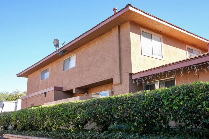 Blue skies and hedges in Capistrano Villas in San Juan Capistrano, CA