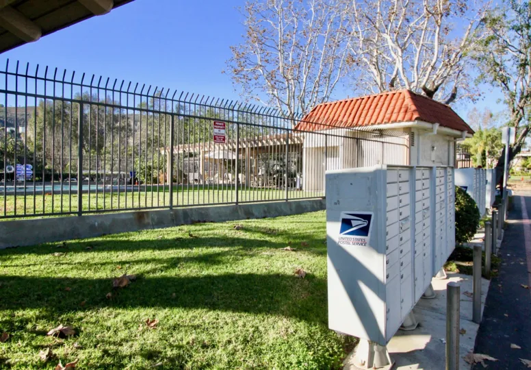 beautiful sunny day green grass and fance in Capistrano Villas
