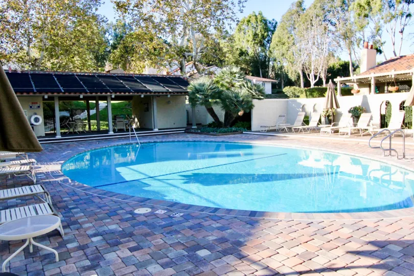 The backyard of your dreams, with an inviting pool surrounded by a private, treesy backyard.