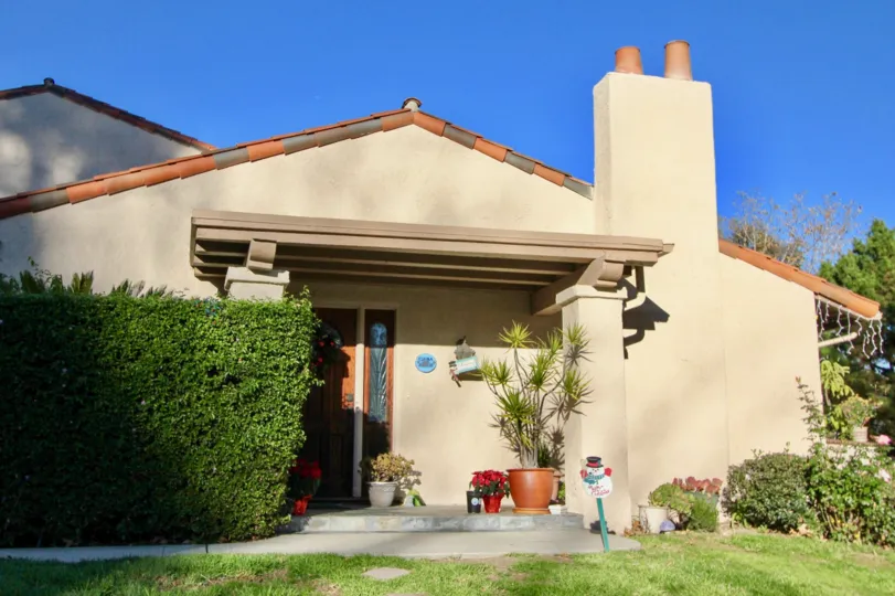 The entrance to a home with hedge and nice plantings in the Captains Hill area of San Juan Capistrano, California