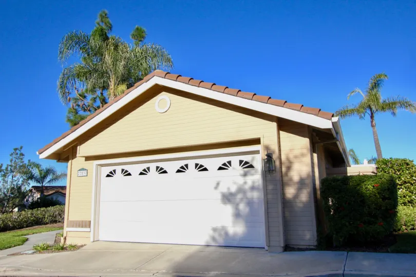 A yellow house with garage in Loma Vista in San Juan Capistrano, CA