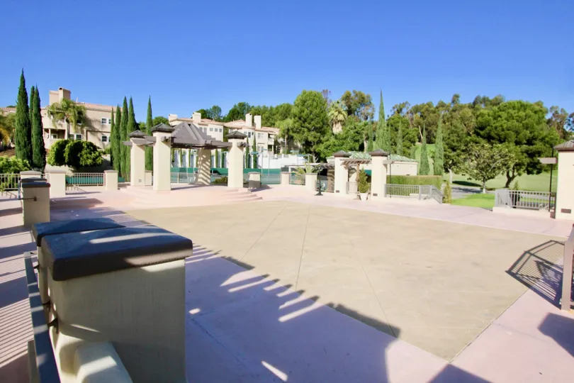 An empty patio is surrounded by fences at the Marbella Golf Villas