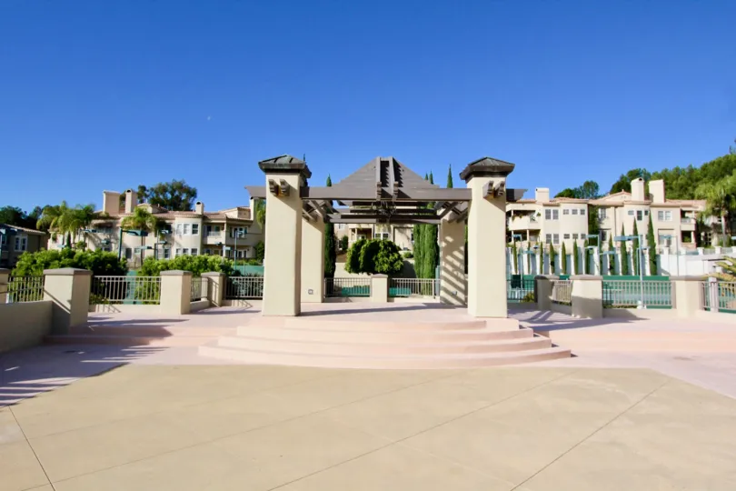 A pathway leading to a pool in Marbella Golf Villas in San Juan Capistrano, CA