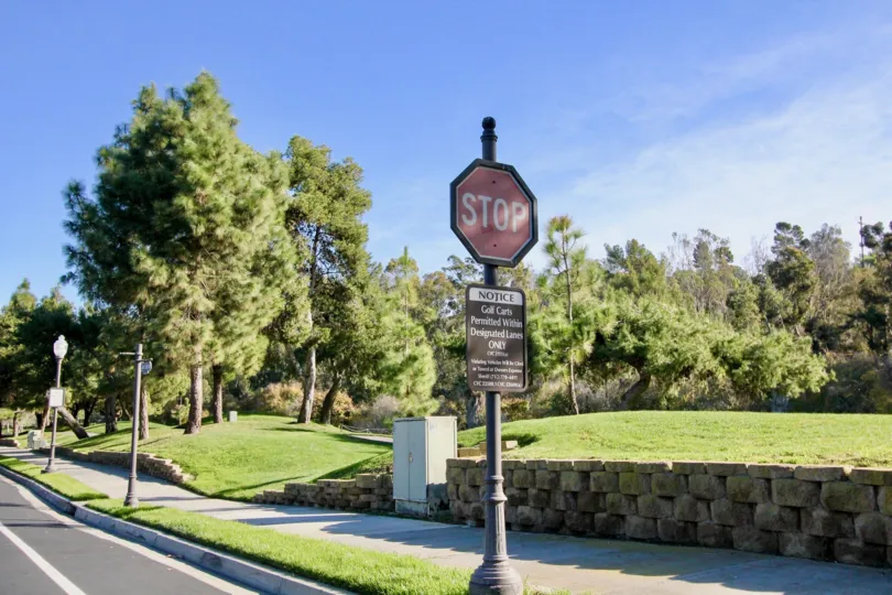 Sidewalk and sign at Marbella Golf Villas in San Juan Capistrano, CA