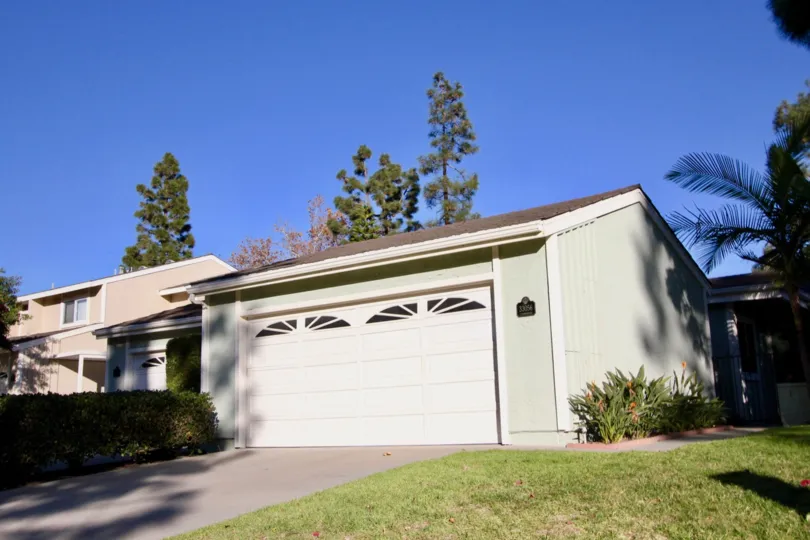 Decorative windows sit on the top panel of a garage in the Mariners Village community