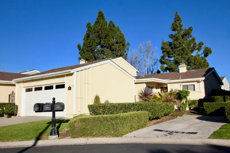 A traditional bungalow with brownish roof in the Mariners Village community.