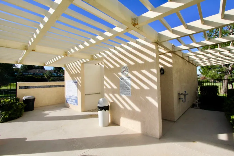 A white wood bathroom outside in Mesa Verde community in San Juan Capistrano, California.