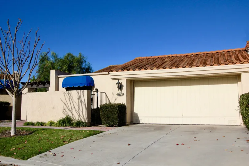Two car garages with secluded patio area in this Mesa Verde community unit