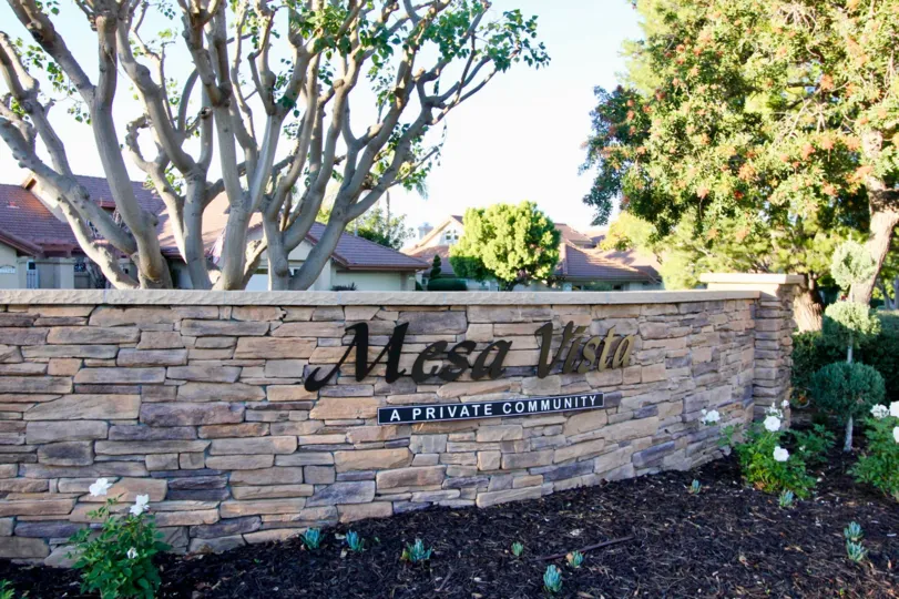 Trees and welcome sign at Mesa Vista North in San Juan Capistrano, CA