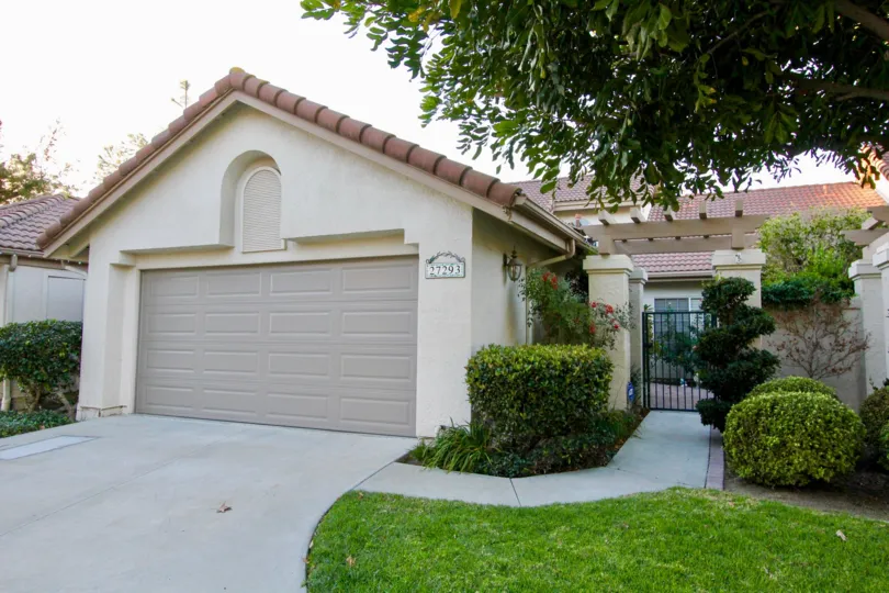 Mature landscaping with private gated entrance to Mesa Vista North community unit