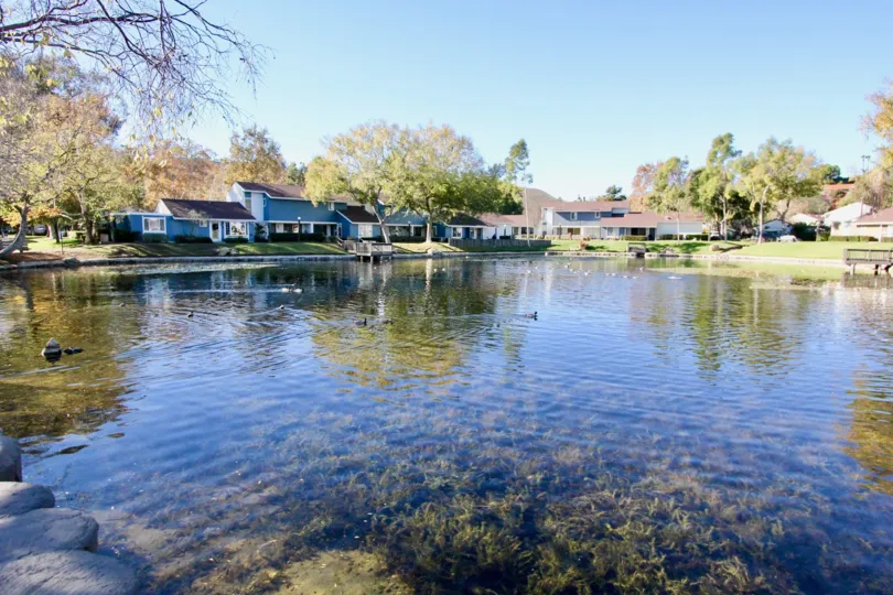A sunny day in the Village San Juan Townhomes with lake frontage
