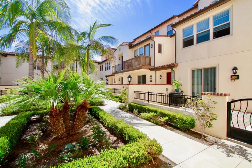 The sunny day in the Avenue E with villas and gardens